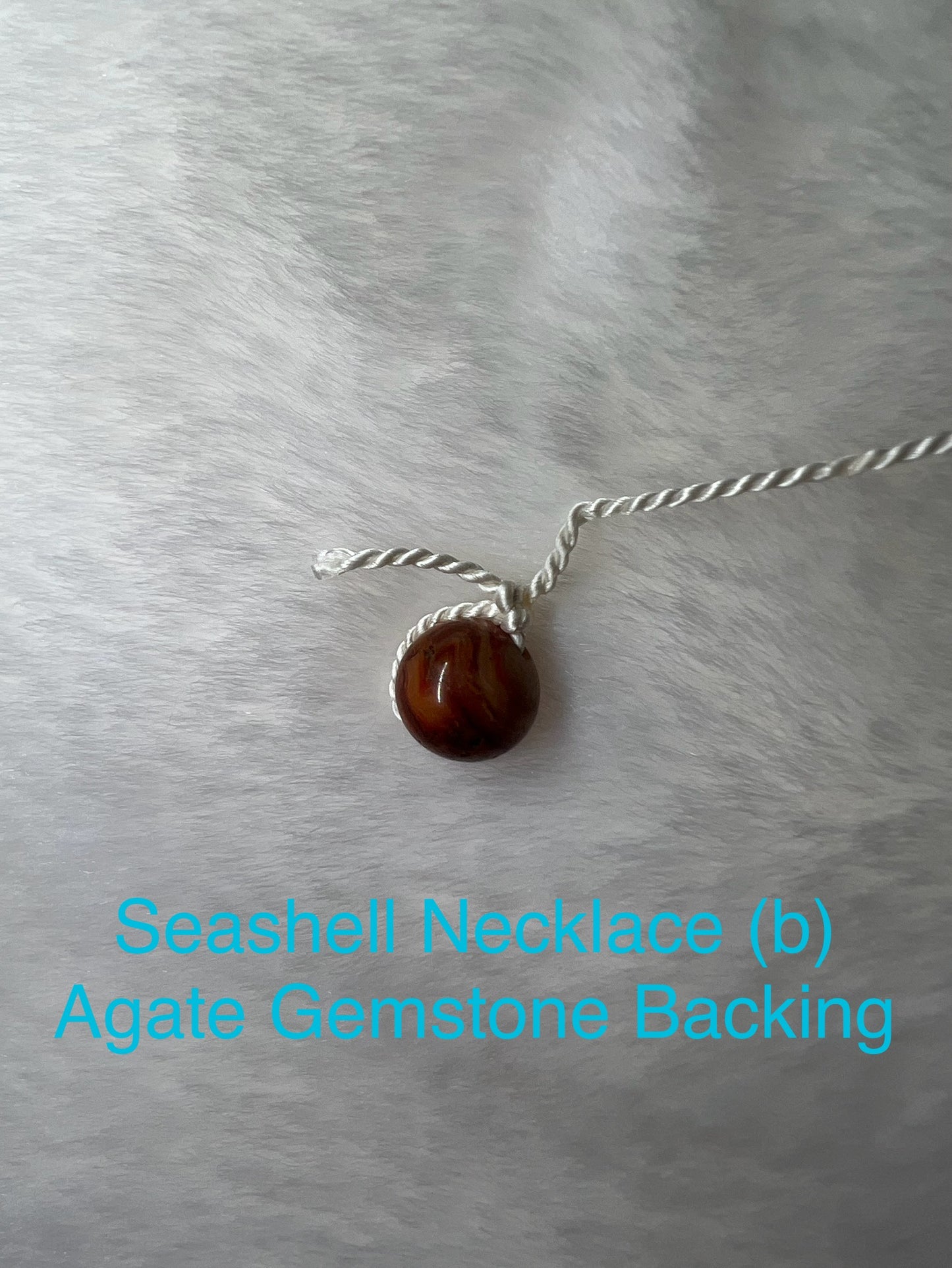 Genuine Seashell Necklace, wrapped on a 100% Silk Thread,  with a Geniune Agate Bead Enclosure