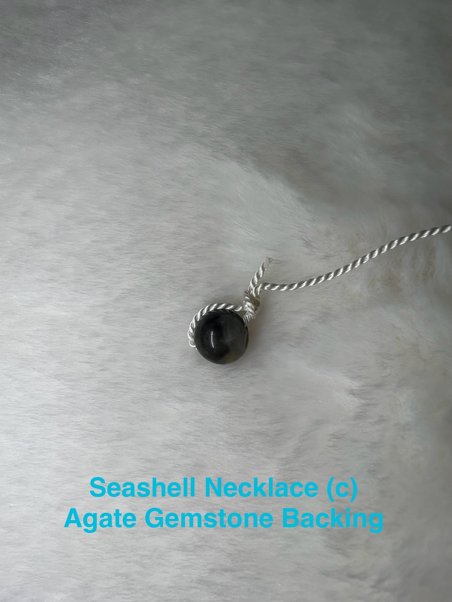 Genuine Seashell Necklace, wrapped on a 100% Silk Thread,  with a Geniune Agate Bead Enclosure