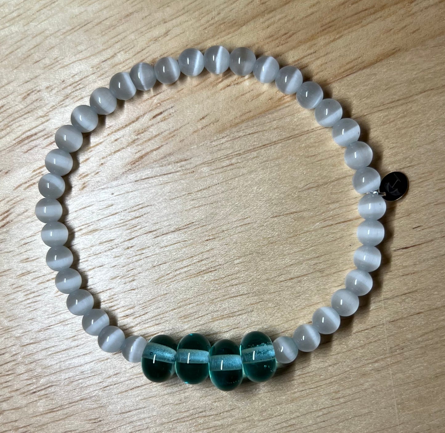 The White Cat Eye Gemstone Bracelet 
(with hand blown Light Blue Glass Beads)